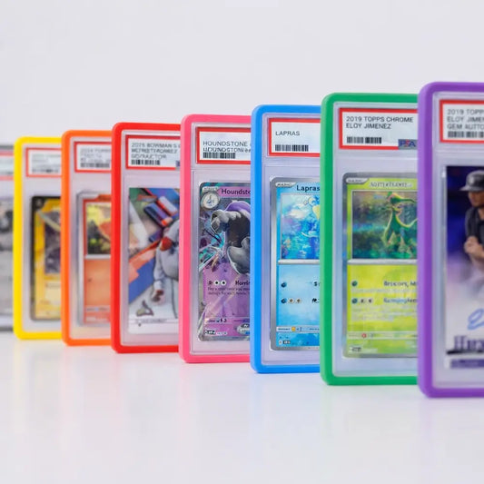A colorful lineup of PSA and CGC graded card slabs featuring yellow, orange, red, pink, blue, green, and purple protective bumper guards.