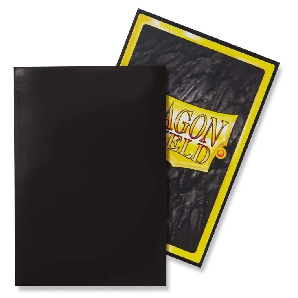 Close-up of Dragon Shield Matte Black Japanese size sleeves showing the small-format textured back and premium protective packaging.