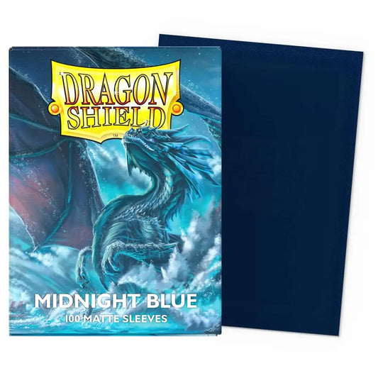Close-up of Dragon Shield Matte Midnight Blue sleeves showing the deep blue textured back and premium protective packaging