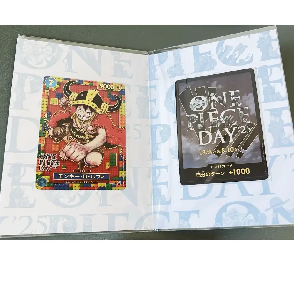 Open card album with 'One Piece' themed cards on a gray background