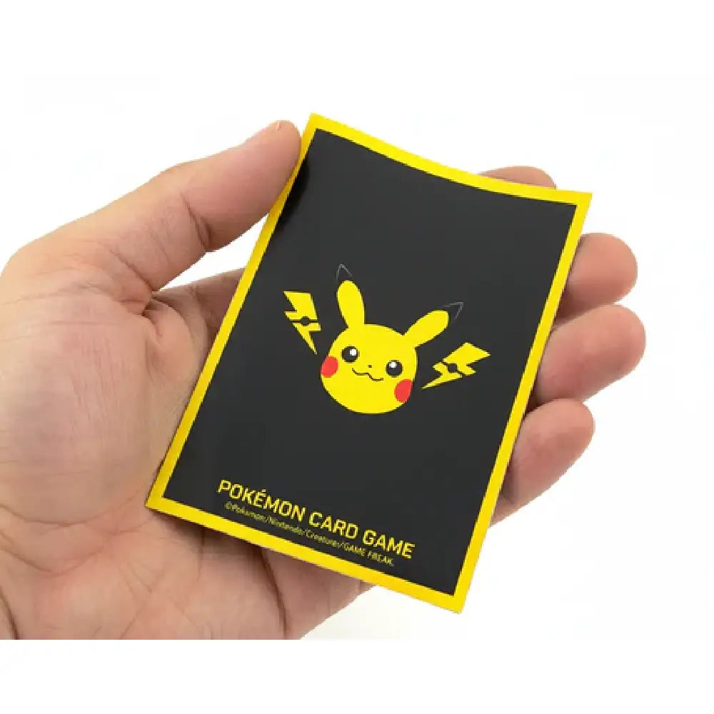 Official Pokémon Center card sleeves featuring Pikachu surrounded by yellow electric lightning bolts with a dark background by TCGVault.
