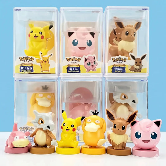 Pokémon mini collectible figures with acrylic display cases featuring Pikachu, Charmander, Psyduck, Bulbasaur, Eevee, Slowpoke, Cubone, Jigglypuff, and Squirtle