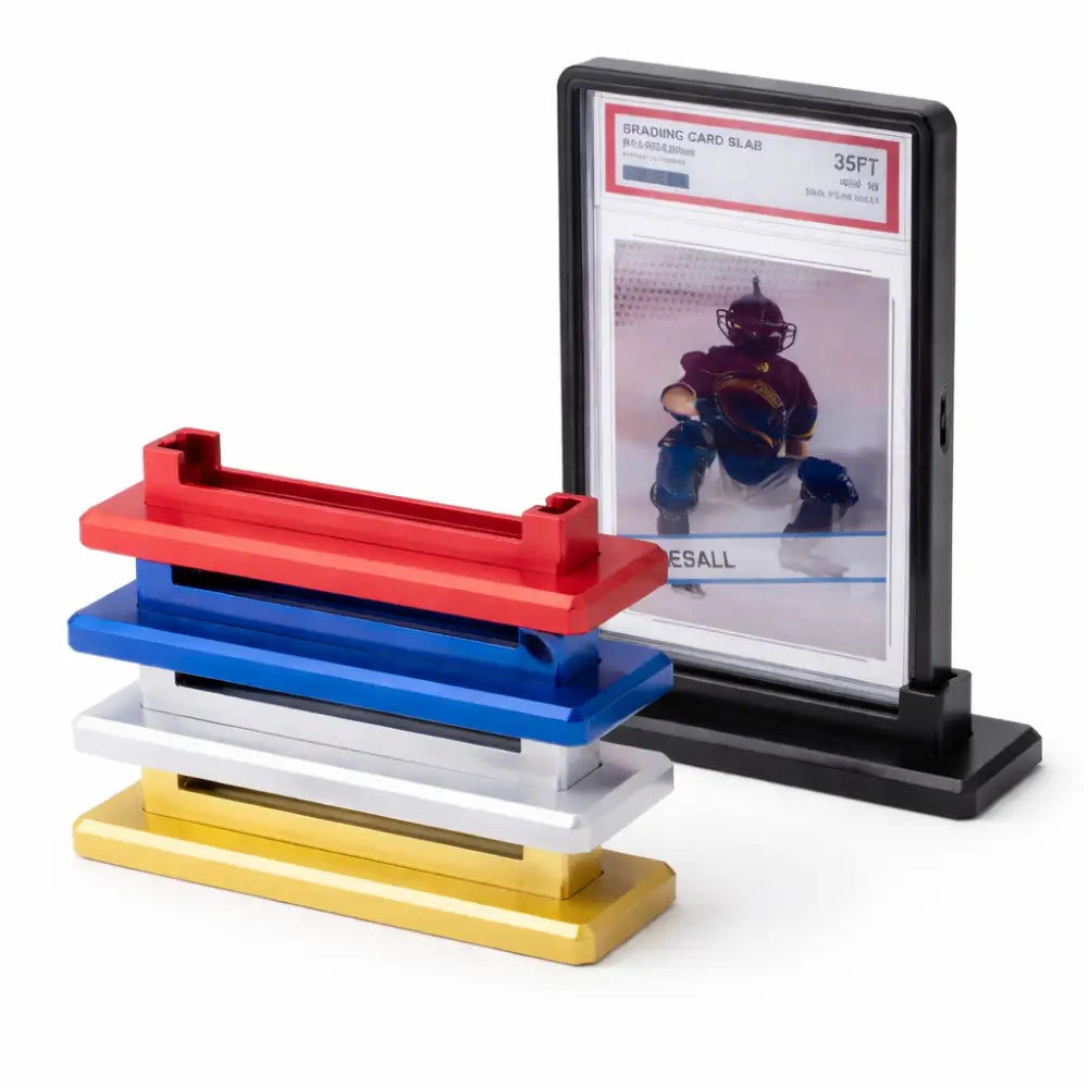 Staked red, blue, silver, and gold aluminum alloy display stands next to a black magnetic card protector holding a graded baseball card by TCGVault.