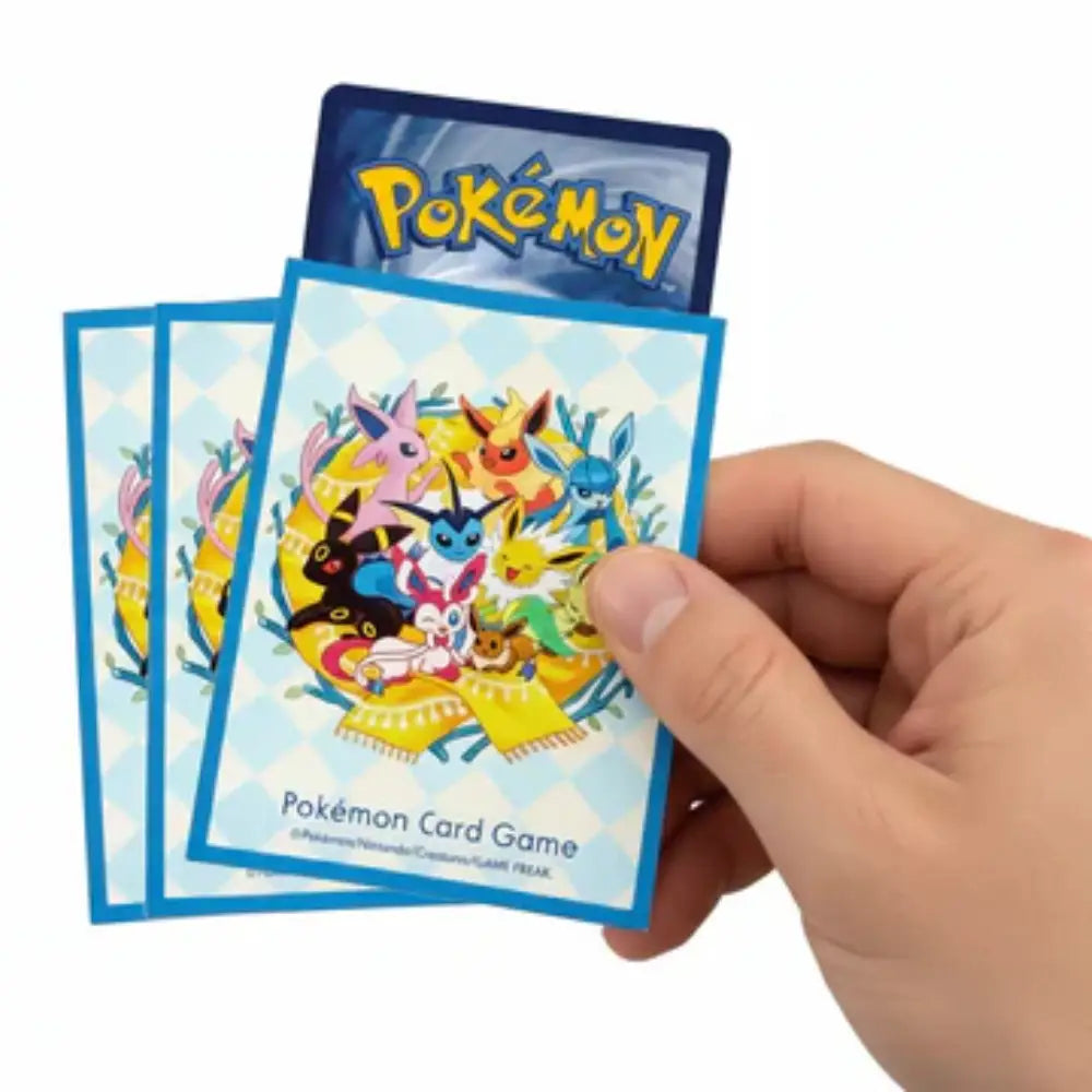 A group of premium Eevee & Eeveelutions 2024 Collection deck shields for Pokémon TCG, showcasing the full elemental evolution family on a dark background.
